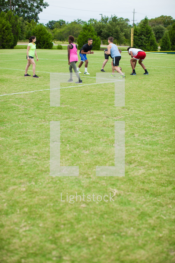 athletes practicing on a sports field 