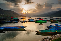 boats in a bay at sunset 