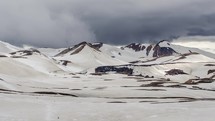 Dramatic clouds moving over winter volcanic mountains in Iceland Lugavegur trek. Time lapse Zoom in
