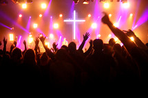 raised hands of an audience at a Christian music festival 