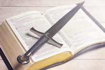 Sword on the pages of a Bible 