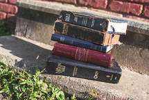 stack of old Bibles outdoors 