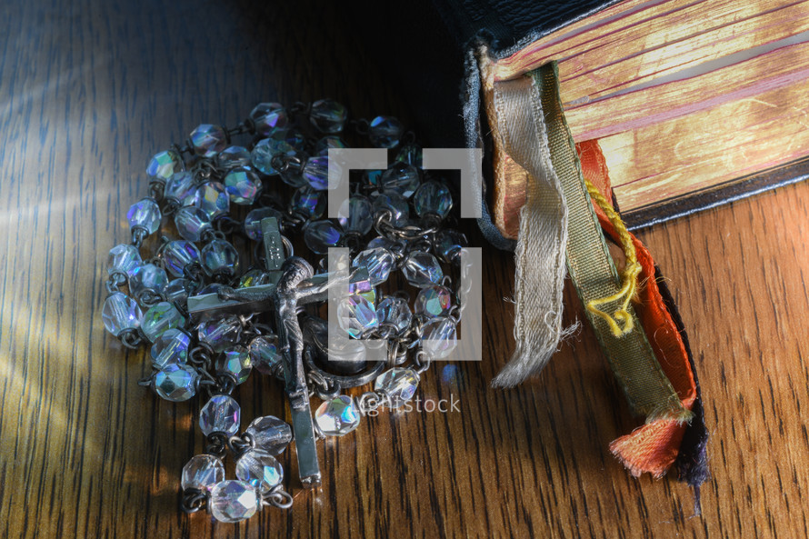 rosary beads and Bible 