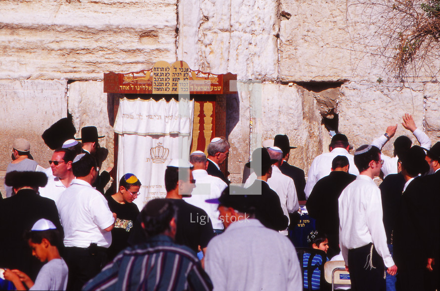 Jewish men gathered at the wailing wall in Jerusalem 
