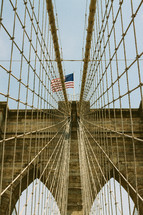 Bridge cables and American flag 