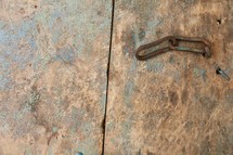 rusty chain on a metal door 