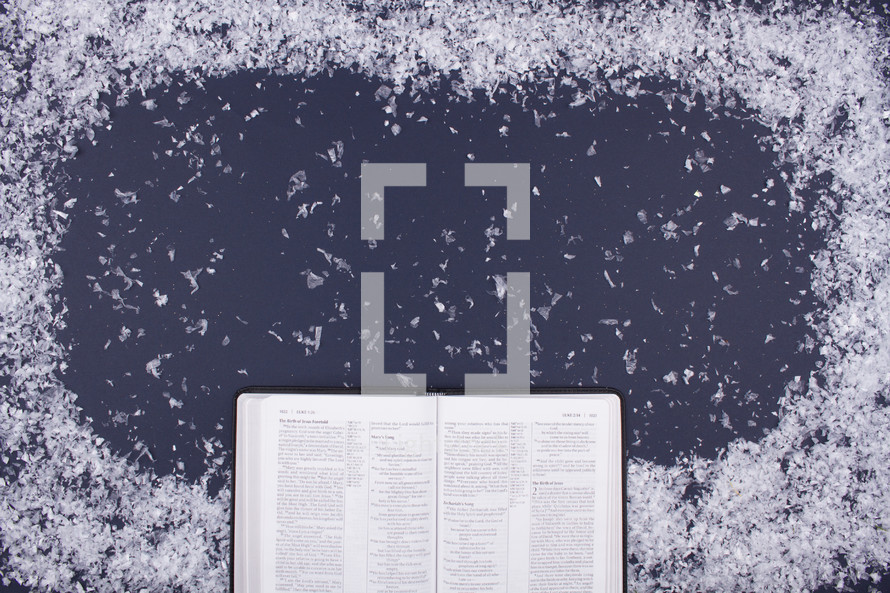 snow border and open Bible 