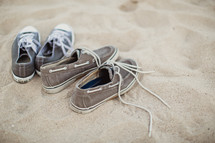 sneakers in the sand at a beach 