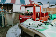 a boy on a ride at the fair 