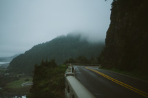 curve on a mountain highway in fog 