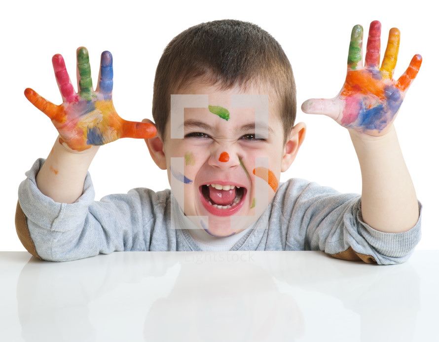 toddler with paint on his hands 