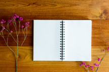 fuchsia flowers and pages of a journal 