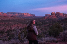 woman standing in a desert landscape 
