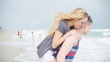 playful couple on a beach 