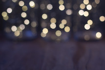 wood floor and bokeh lights from a Christmas tree