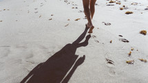 walking barefoot on a beach 