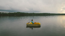 woman in a paddle boat 