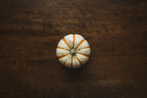 pumpkin on a wood table