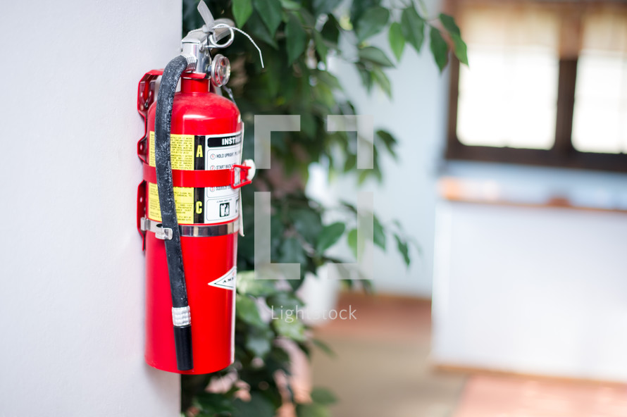 Fire extinguisher on a wall.