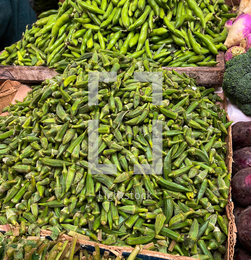 Pile of ripe okra for sale at local farmers market