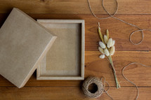  flowers, twine, and empty gift box 