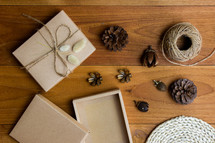 brown gift box and pine cones 