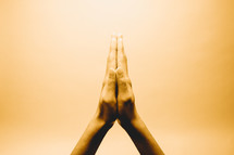 raised praying hands 