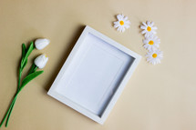 spring flowers and blank frame 