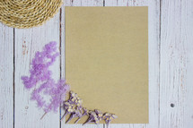 purple flowers and blank paper 