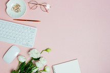 pink computer desk with notebook and roses 