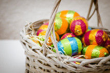 Colored easter eggs in a wicker basket