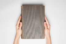 hands on an old book 