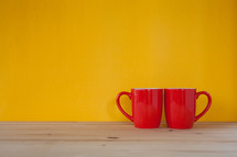 two red coffee mugs