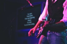 Worship leader playing the guitar and singing