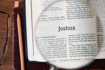 magnifying glass over Joshua 