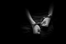 handcuffed teen boy 