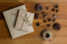 brown paper gift box and pine cones 