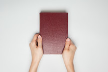 hands on a Bible 