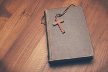 a wooden cross on a book