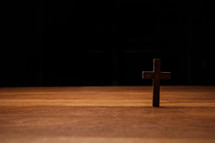 a small cross on wood 