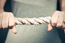 holding onto a thick rope
