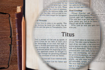 magnifying glass over Titus 