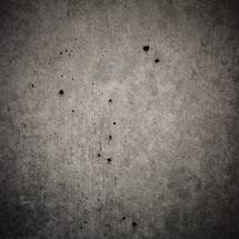 holes in a concrete wall 