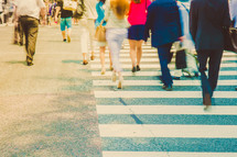 people crossing a crosswalk 