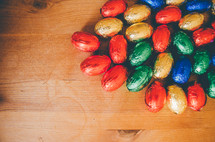 Colored easter eggs on a wooden table