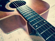 acoustic guitar and sheet music