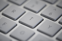 A cross key on a keyboard.