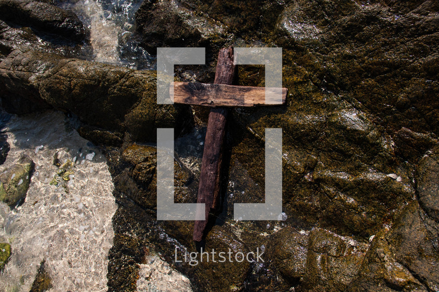 cross on rocks 
