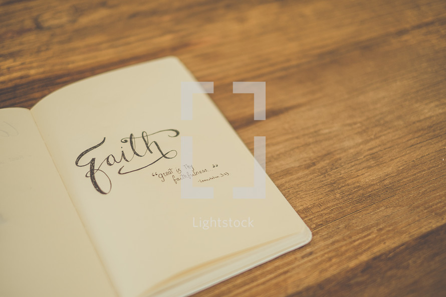 Book of faith on a wooden table.