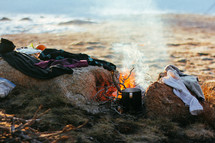 drying clothes by a campfire 